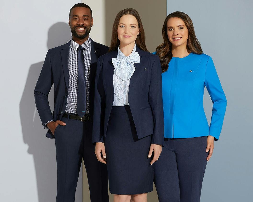 Image of three people in matching uniforms